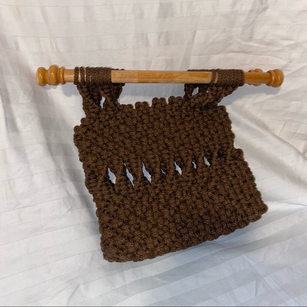Brown woven purse with wood handle